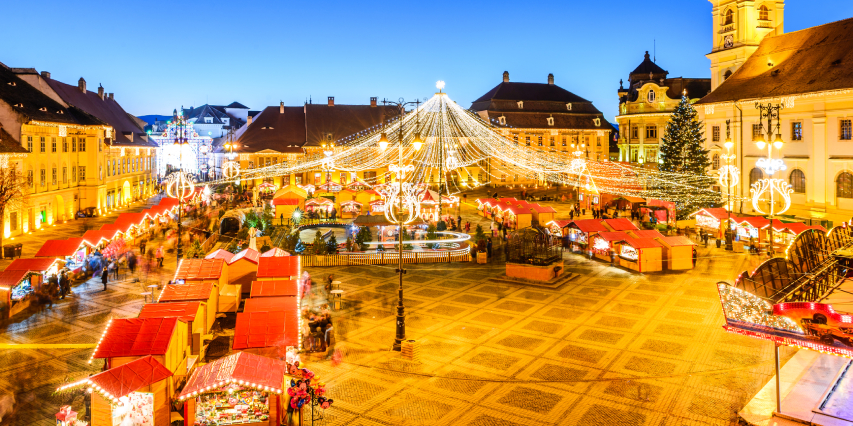 Sibiu Christmas Market during night, with all that lights and markets with hot wine, homemade chocolate