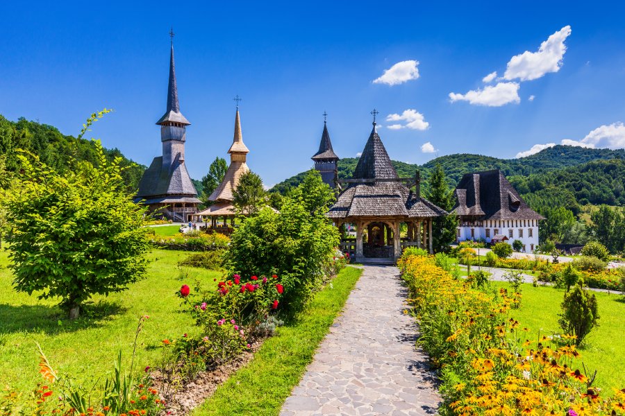 Barsana Monastery, full of vegetation and a wooden church