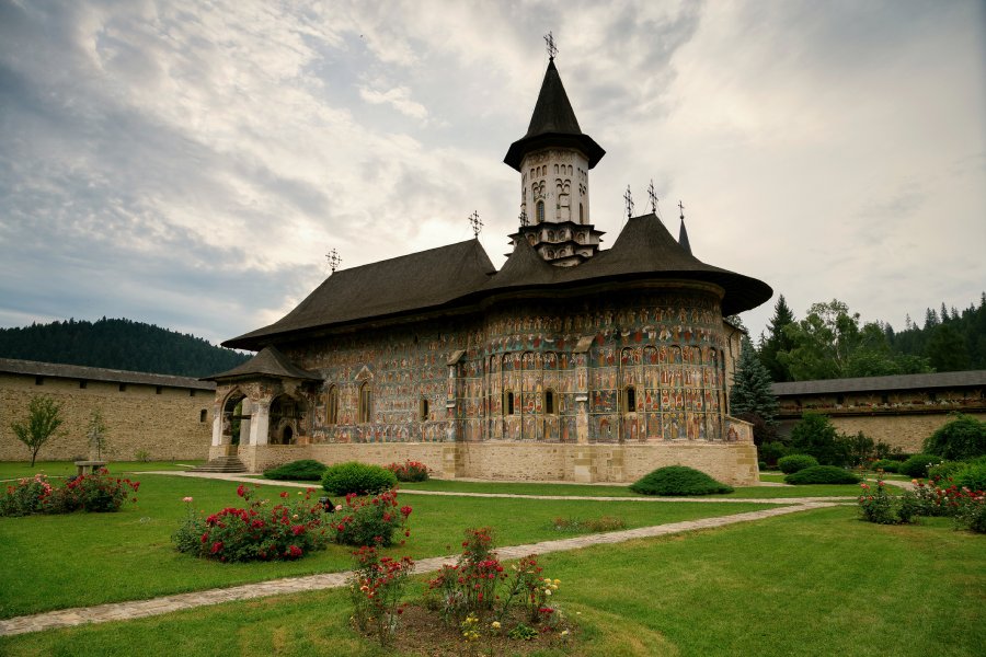 Sucevita Monastery - maiestuos monastery, with vegetation around, in a sunny day