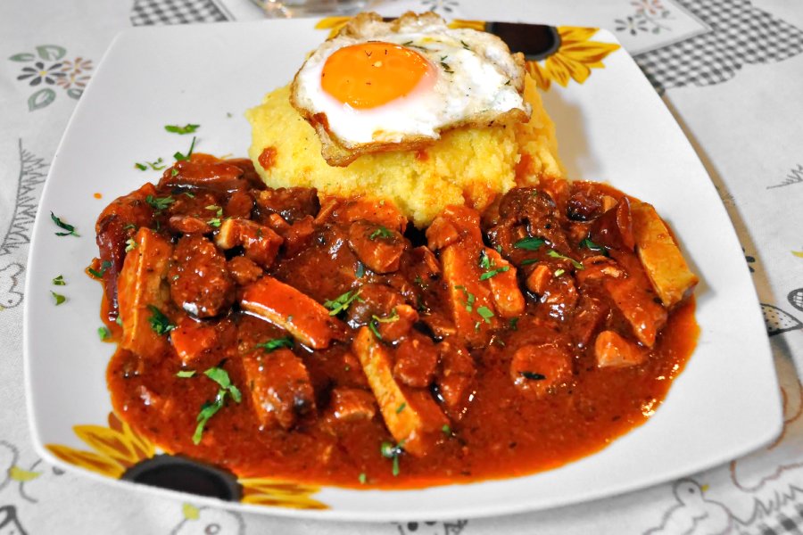 Tochitura is a romanian traditional food made with from beef and pork in tomato sauce