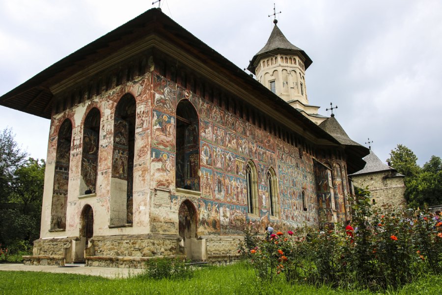 Moldovita Monastery beautiful monastery in Bukovina - mural painting, beautiful flowers