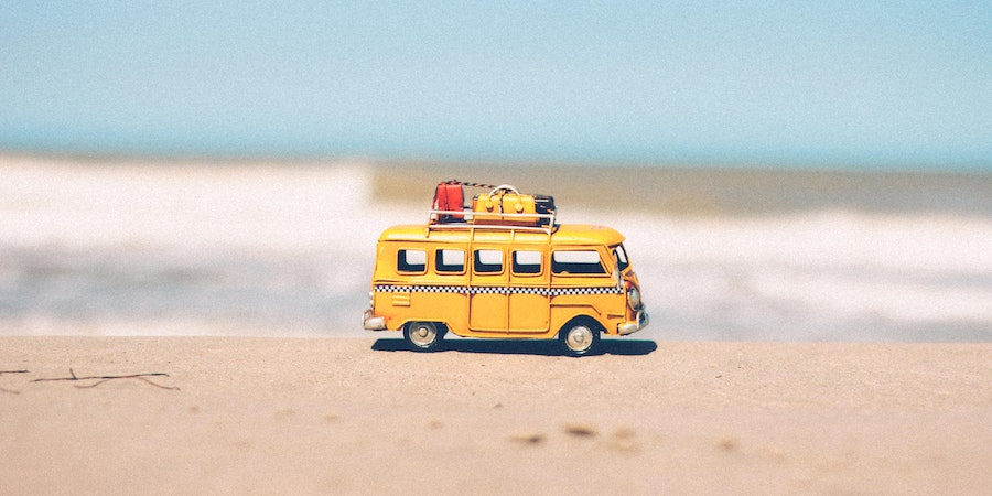 Toy car on sea beach